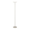 Beige floor lamp with a round base and slim vertical pole, topped by a small horizontal light fixture shelf area.
