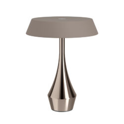 Table lamp with a glossy bronze, sculptural base and a taupe fabric drum shade on a white background.