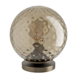 A textured glass sphere on a metal pedestal, decorative tabletop ornament or lamp base visible from the side view.