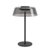 Modern black desk lamp with a smoky gray, dome-shaped shade and circular base