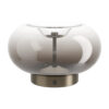 Table lamp with a large clear glass bubble shade and a bronze base with a small switch on the base