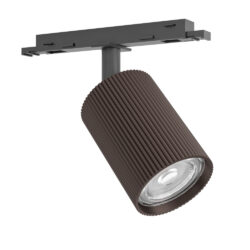 Brown ribbed cylindrical track light mounted on a ceiling rail with adjustable head