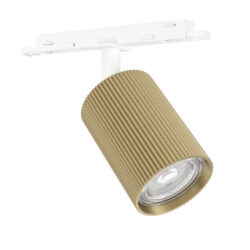 Gold ribbed cylindrical ceiling spotlight mounted on a white track rail, angled to illuminate a area